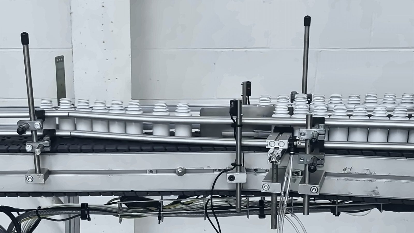 White PET bottles queued on the conveyor at our Lancashire unit